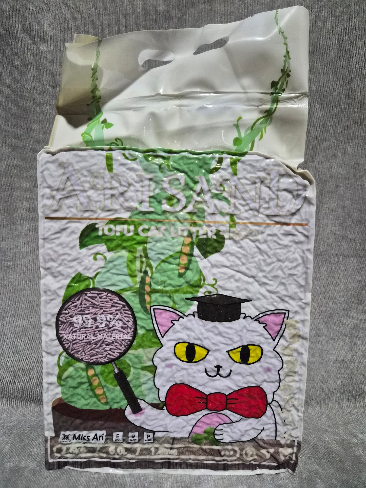 Textile with a cartoon cat design on a gray background